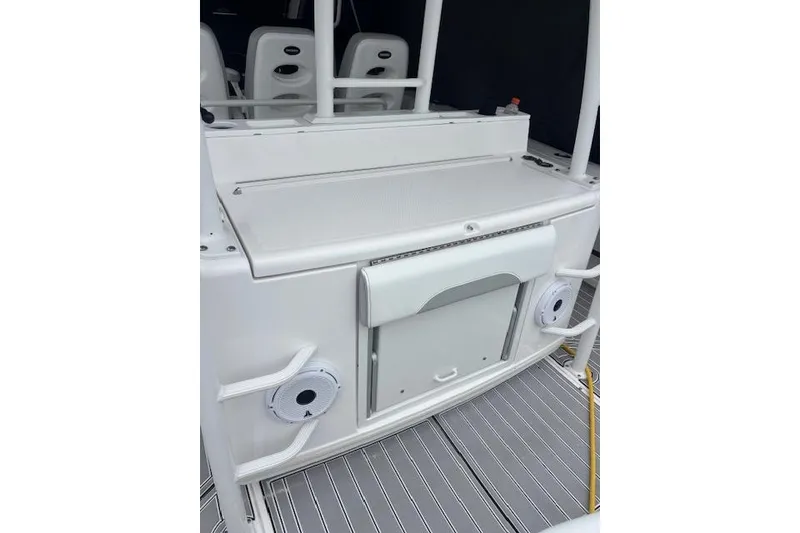 Slide: The Image of 2018 Everglades 435 Center Console boat interior with seating and storage features. - 30