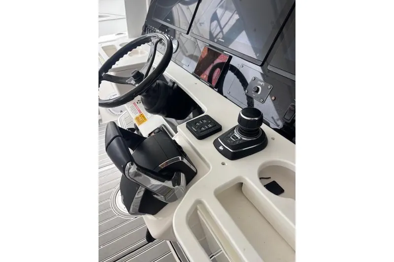 Slide: The Image of Steering console of 2018 Everglades 435 Center Console boat with modern controls. - 38