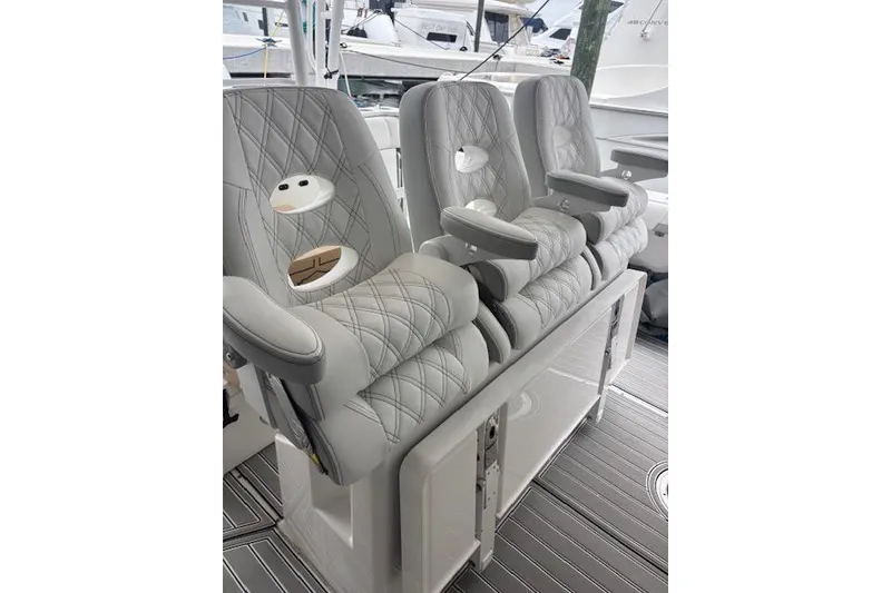 Slide: The Image of Luxurious seating on 2018 Everglades 435 Center Console boat, featuring quilted upholstery. - 39