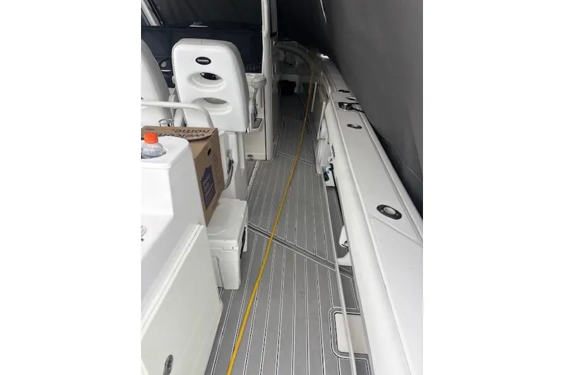 Slide: The Image of 2018 Everglades 435 Center Console boat interior with seating and storage. - 40
