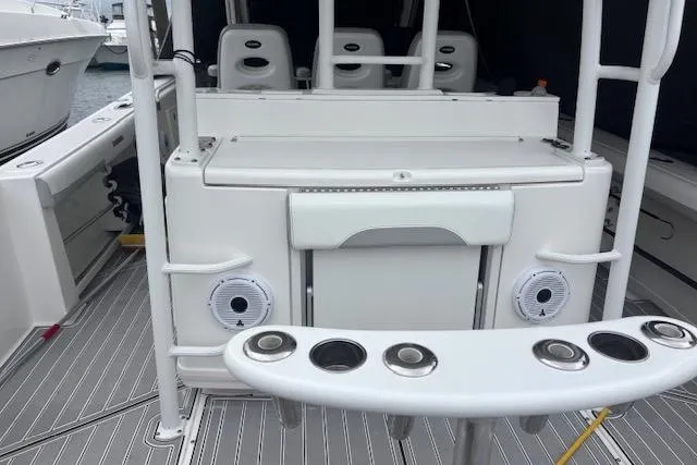 Slide: The Image of 2018 Everglades 435 Center Console boat interior with rod holders and seating. - 44
