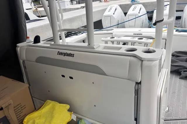 Slide: The Image of 2018 Everglades 435 Center Console boat interior with seating and storage compartments. - 47