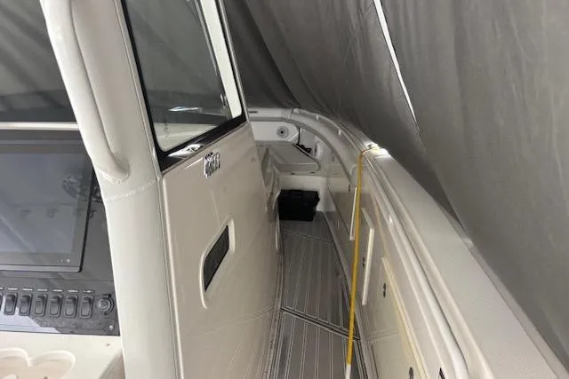 Slide: The Image of 2018 Everglades 435 Center Console boat interior with sleek design and modern controls. - 53