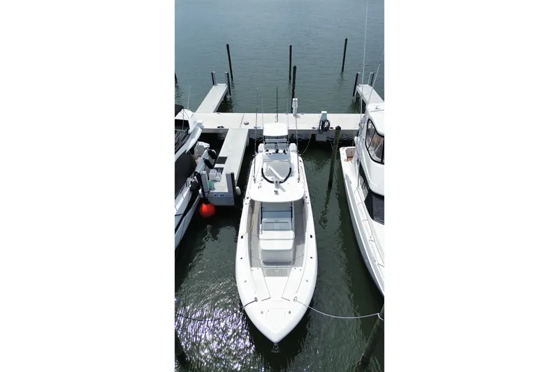 Slide: The Image of 2018 Everglades 435 Center Console boat docked at marina, aerial view. - 7