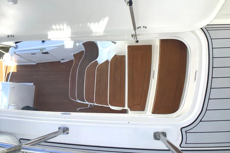 Slide: The Image of Staircase on 2007 Sea Ray 52 Sedan Bridge yacht with wooden steps and sleek design. - 13