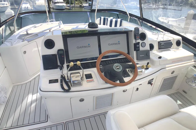 Slide: The Image of 2007 Sea Ray 52 Sedan Bridge helm with Garmin navigation system and luxurious seating. - 14