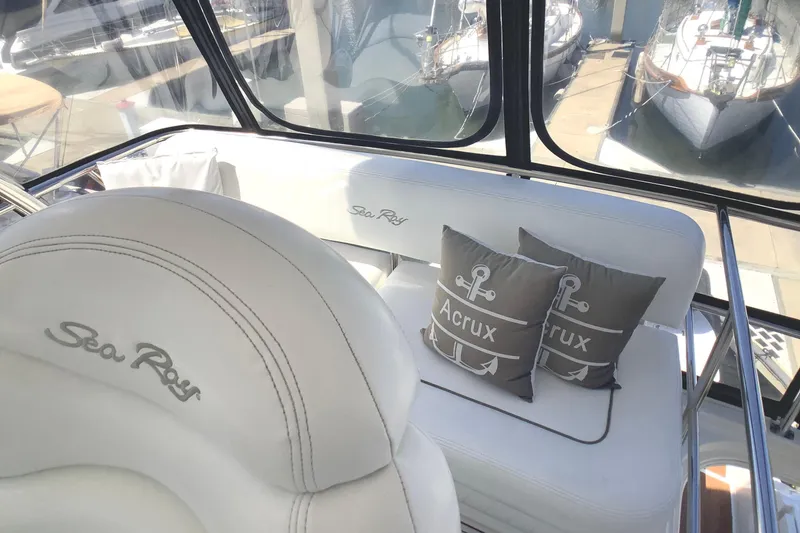 Slide: The Image of Luxurious 2007 Sea Ray 52 Sedan Bridge interior with plush seating and nautical-themed cushions. - 18