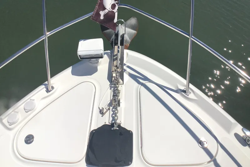 Slide: The Image of Bow view of 2007 Sea Ray 52 Sedan Bridge yacht with anchor and railing. - 23