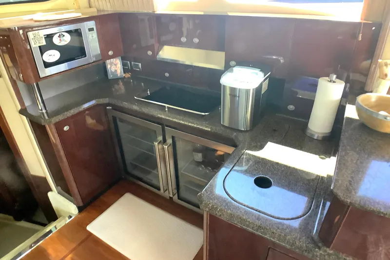 Slide: The Image of Luxurious kitchen area in a 2007 Sea Ray 52 Sedan Bridge yacht. - 32