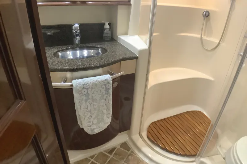 Slide: The Image of Luxurious bathroom in 2007 Sea Ray 52 Sedan Bridge yacht with sink and shower. - 35