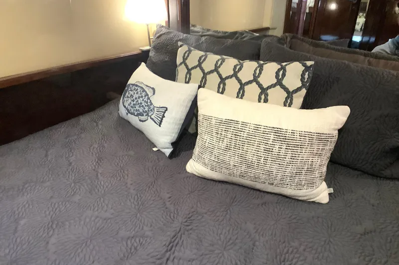 Slide: The Image of Luxurious bedroom interior on 2007 Sea Ray 52 Sedan Bridge yacht with decorative pillows. - 37