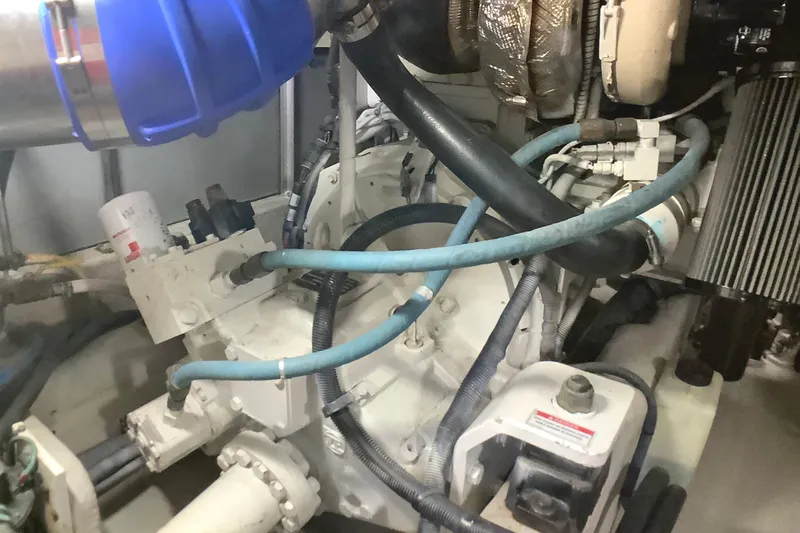 Slide: The Image of Engine compartment of a 2007 Sea Ray 52 Sedan Bridge with visible hoses and components. - 41