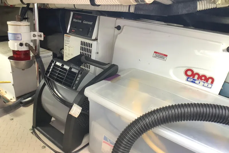 Slide: The Image of Engine room of 2007 Sea Ray 52 Sedan Bridge with Onan marine generator and equipment. - 43