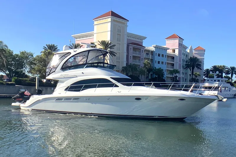 Slide: The Image of 2007 Sea Ray 52 Sedan Bridge yacht docked near waterfront buildings. - 5
