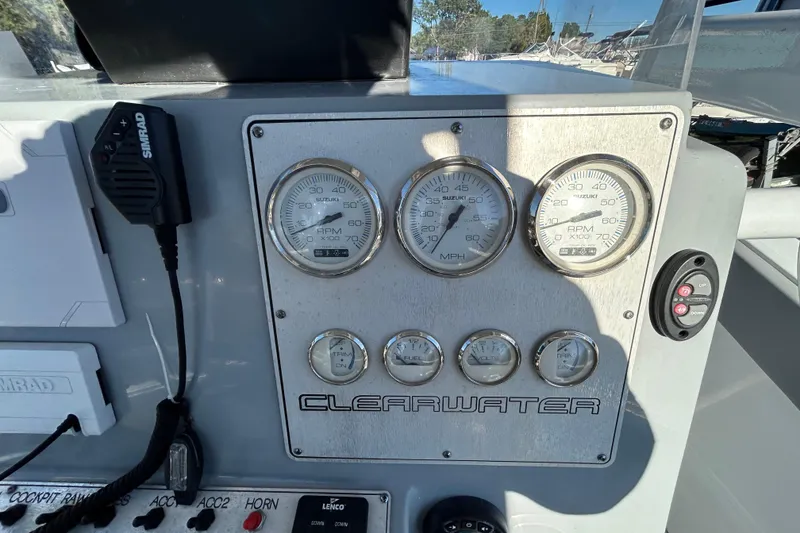 Slide: The Image of Dashboard of 2022 Clearwater 2300 boat with gauges and controls. - 12