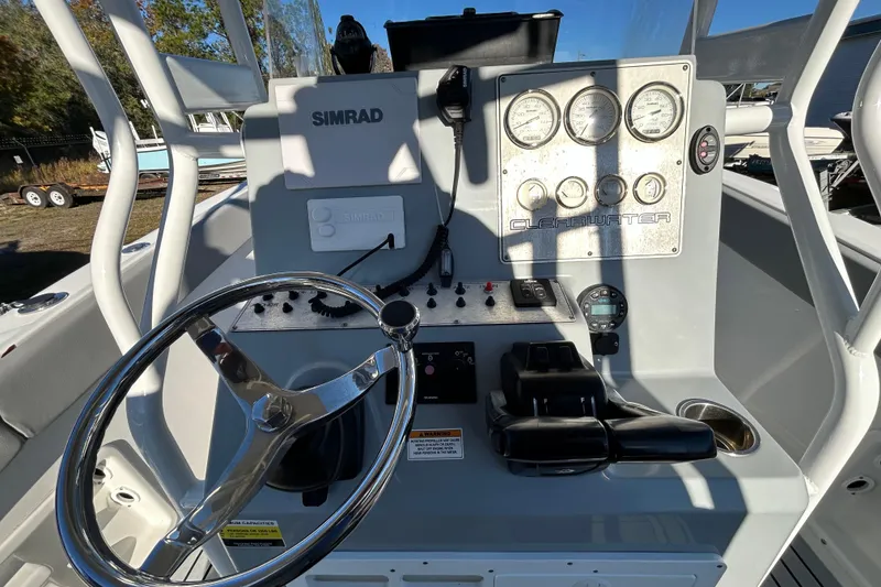 Slide: The Image of Clearwater 2300 boat dashboard with steering wheel and gauges, 2022 model. - 15