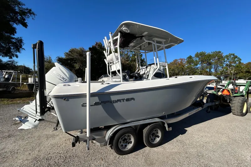 Slide: The Image of 2022 Clearwater 2300 boat on trailer with Suzuki engine, parked outdoors. - 3