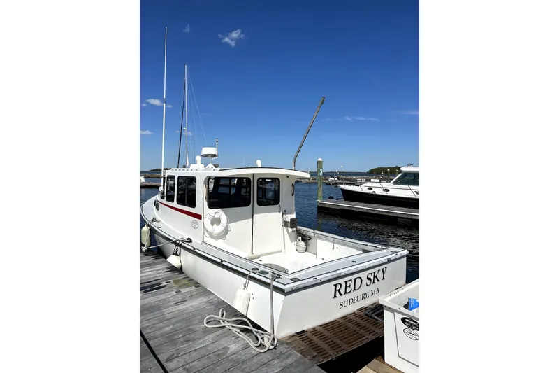 Slide: The Image of 1988 Duffy 31 Lobster Boat "Red Sky" docked under clear blue sky. - 2