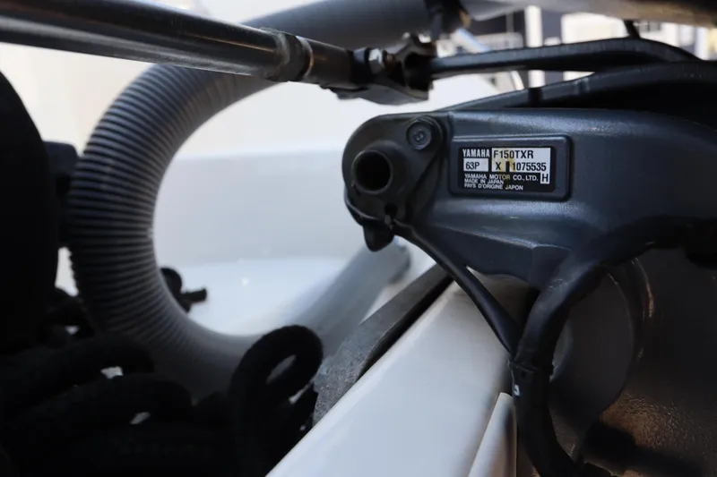 Slide: The Image of Close-up of a Yamaha F150TXR engine part on a 2009 Century 2400 Walk-Around boat. - 10