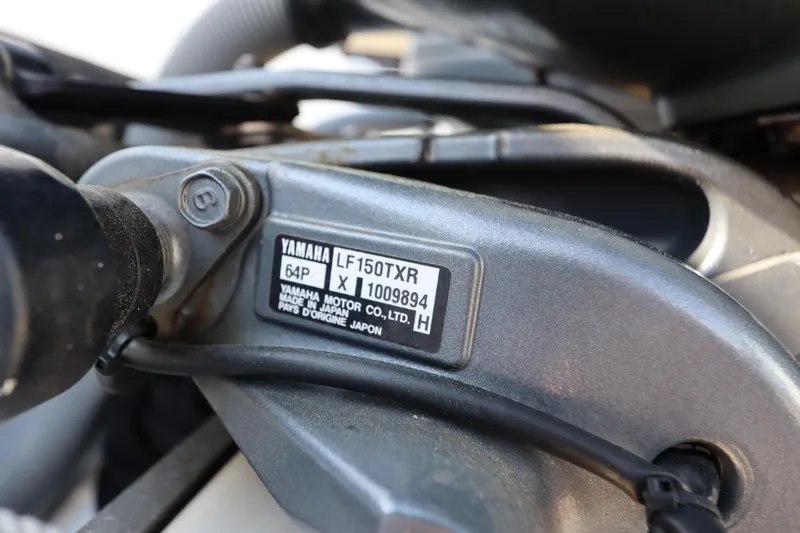 Slide: The Image of Yamaha LF150TXR engine label on 2009 Century 2400 Walk-Around boat. - 11