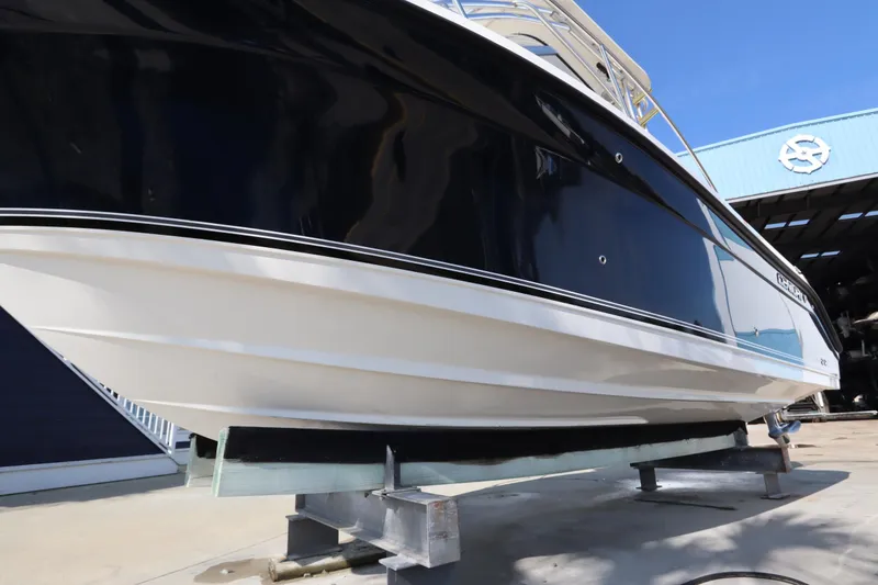 Slide: The Image of 2009 Century 2400 Walk-Around boat on dry dock, side view. - 14