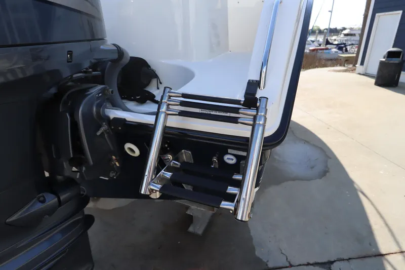 Slide: The Image of Rear view of a 2009 Century 2400 Walk-Around boat with a stainless steel ladder. - 15