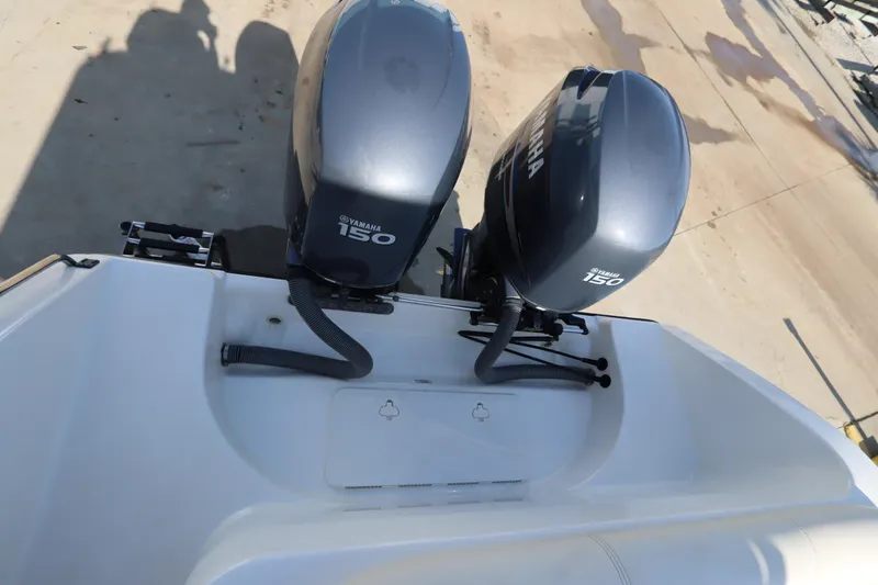 Slide: The Image of 2009 Century 2400 Walk-Around boat with dual Yamaha 150 engines. - 16