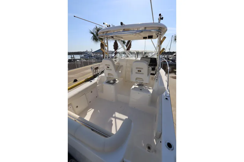 Slide: The Image of 2009 Century 2400 Walk-Around boat interior with seating and helm - 19