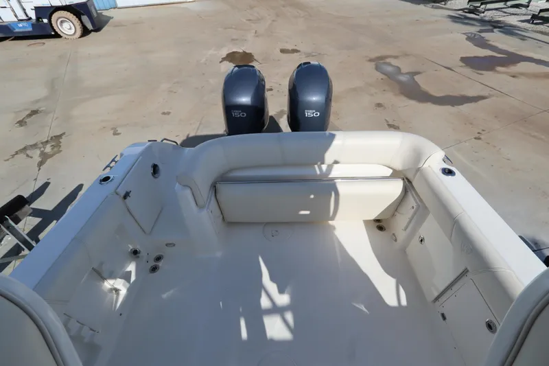 Slide: The Image of 2009 Century 2400 Walk-Around boat interior with twin 150 horsepower engines. - 31