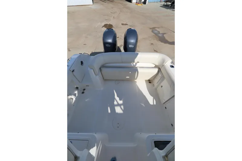 Slide: The Image of 2009 Century 2400 Walk-Around boat interior with twin 150 engines - 32