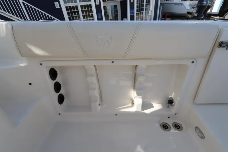 Slide: The Image of 2009 Century 2400 Walk-Around boat interior detail with storage compartments. - 34