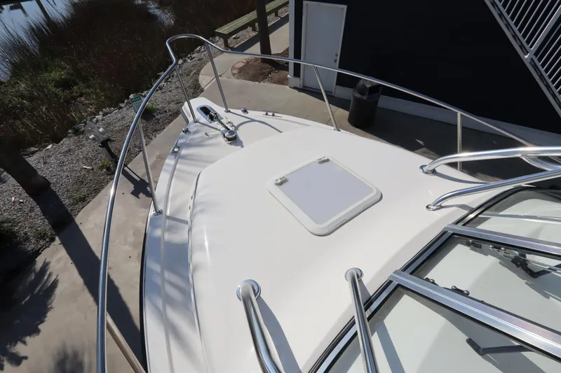 Slide: The Image of 2009 Century 2400 Walk-Around boat deck with railing and hatch - 38
