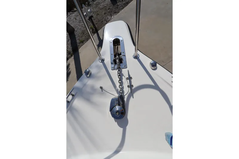 Slide: The Image of 2009 Century 2400 Walk-Around boat deck with anchor chain and railing. - 40
