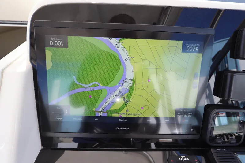 Slide: The Image of Garmin GPS display on 2009 Century 2400 Walk-Around boat showing navigation map. - 49