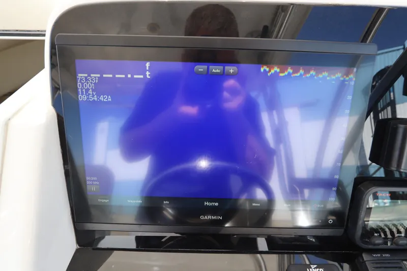 Slide: The Image of Garmin marine display on 2009 Century 2400 Walk-Around boat dashboard. - 50