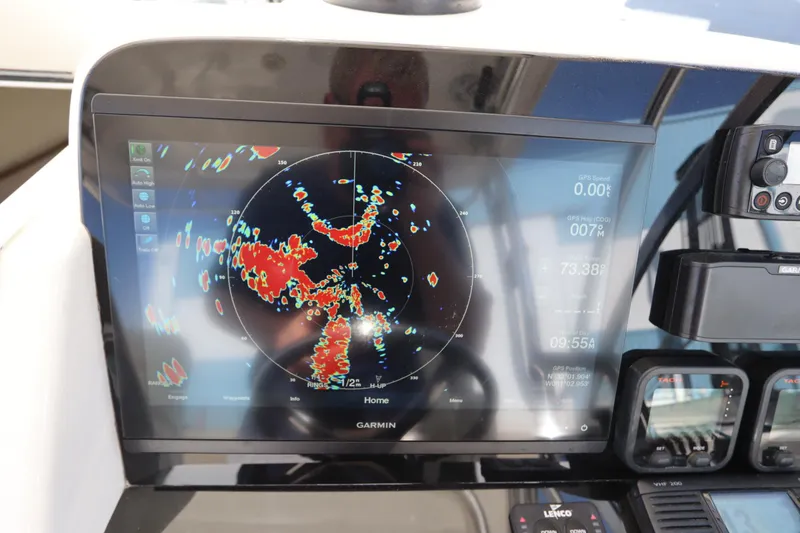 Slide: The Image of Garmin marine radar display on 2009 Century 2400 Walk-Around boat dashboard. - 51