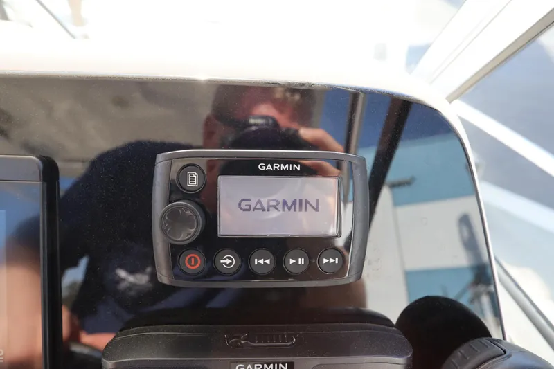 Slide: The Image of Garmin device on 2009 Century 2400 Walk-Around boat dashboard. - 52