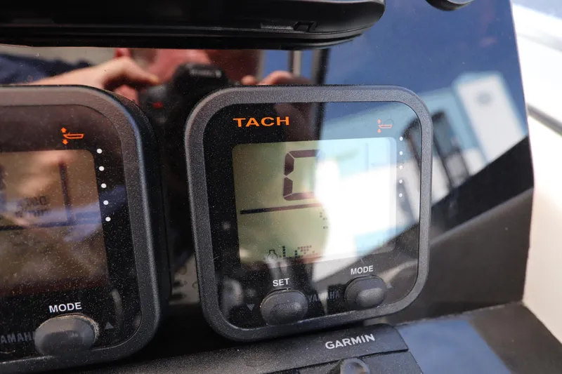Slide: The Image of Tachometer display on 2009 Century 2400 Walk-Around boat dashboard. - 57