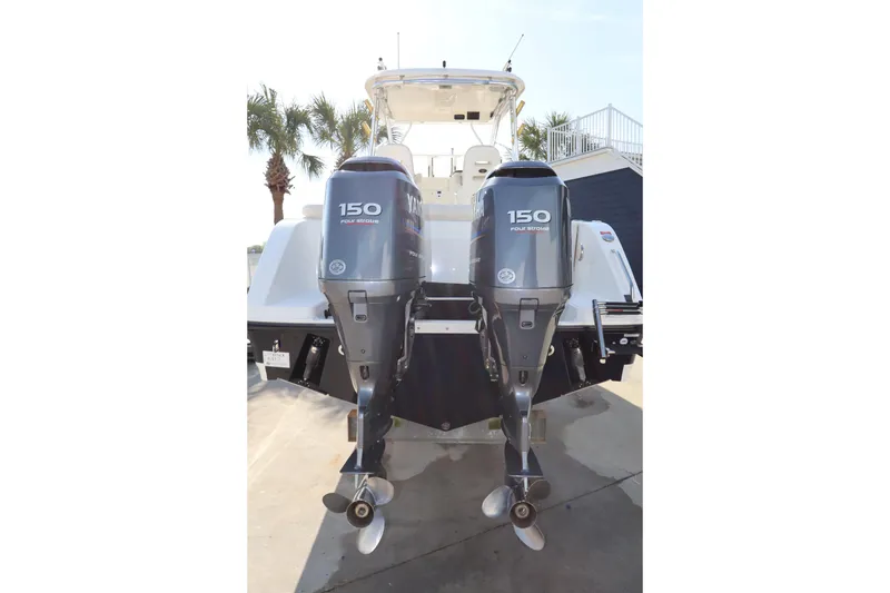 Slide: The Image of 2009 Century 2400 Walk-Around boat with dual Yamaha 150 outboard engines. - 8