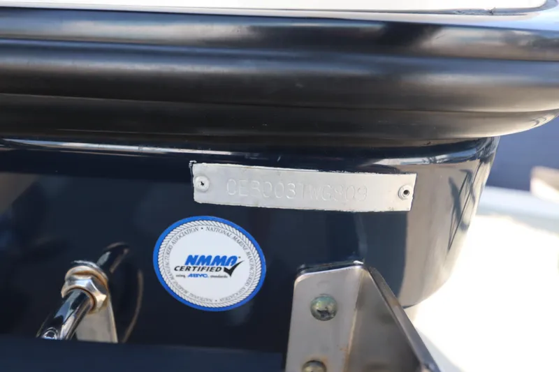 Slide: The Image of 2009 Century 2400 Walk-Around boat with NMMA certification label and hull identification number. - 9