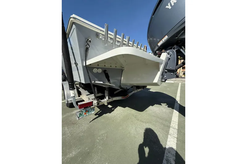 Slide: The Image of Rear view of 2023 Parker 2320 Sport Cabin boat on trailer, sunny day. - 15