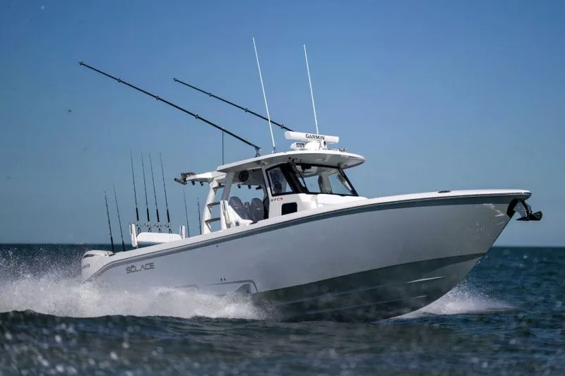 The Image of Manufacturer Provided Image: 2026 Solace 37 CS boat cruising on open water, equipped with fishing rods. - 0
