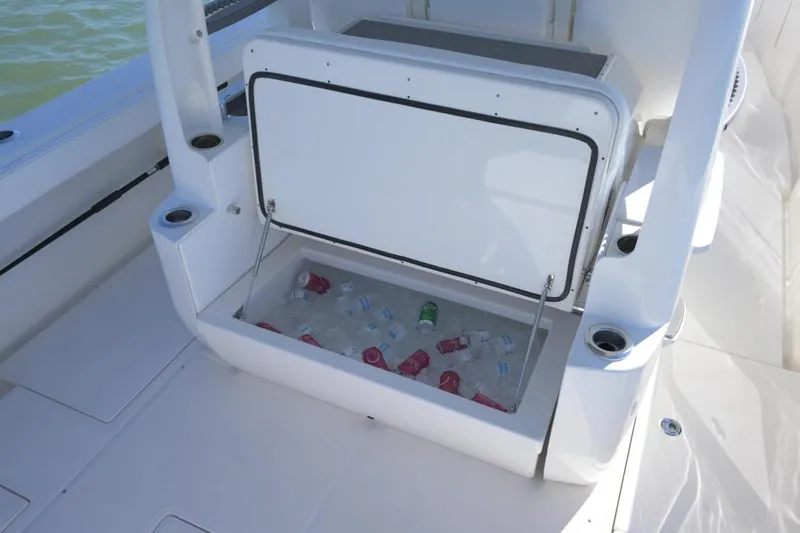 Slide: The Image of Manufacturer Provided Image: Open storage compartment on 2026 Solace 37 CS boat with bottled drinks inside. - 7