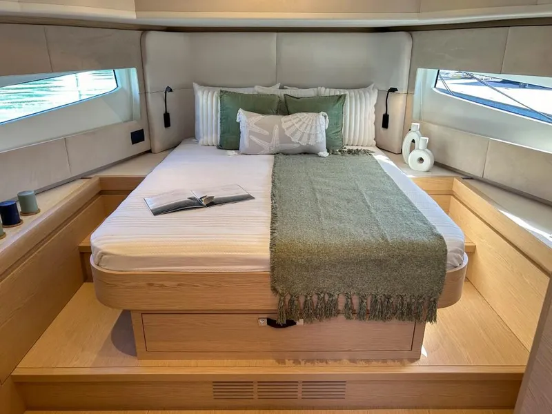 Slide: The Image of Luxurious bedroom interior of 2024 Solaris Power 52 Open yacht with large bed and windows. - 25