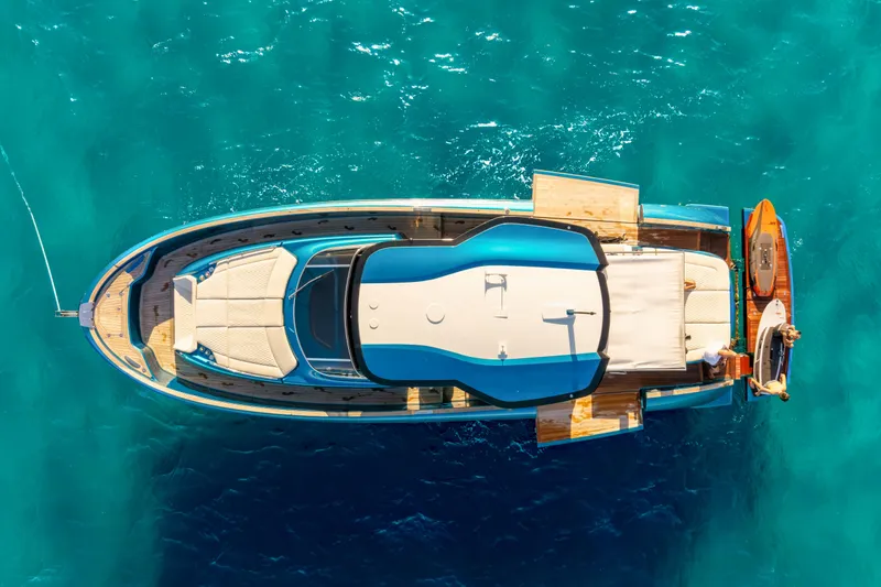 Slide: The Image of Top view of 2024 Solaris Power 52 Open yacht on turquoise water. - 4