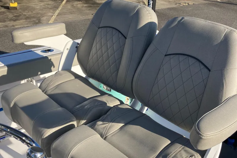 Slide: The Image of 2023 Sportsman Open 242 Center Console boat seats with diamond stitching. - 11