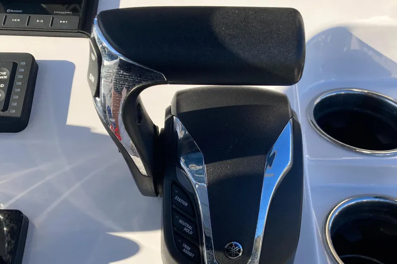Slide: The Image of Throttle control of 2023 Sportsman Open 242 Center Console boat. - 12