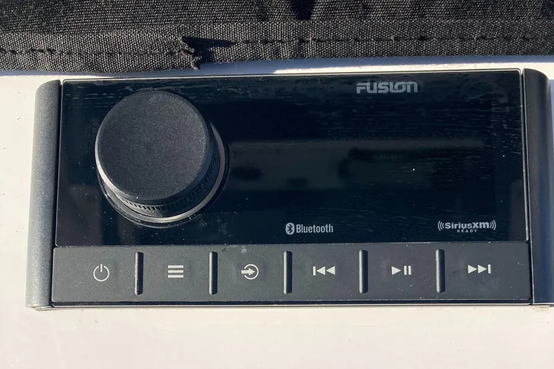 Slide: The Image of 2023 Sportsman Open 242 Center Console audio system with Bluetooth and SiriusXM features. - 13