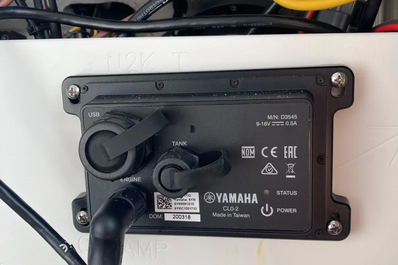 Slide: The Image of Control panel on a 2023 Sportsman Open 242 Center Console boat, featuring Yamaha components. - 21