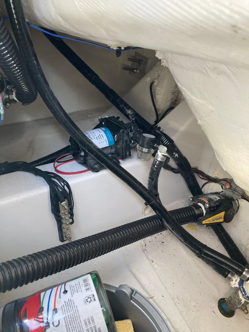 Slide: The Image of 2023 Sportsman Open 242 Center Console boat wiring and pump system. - 26